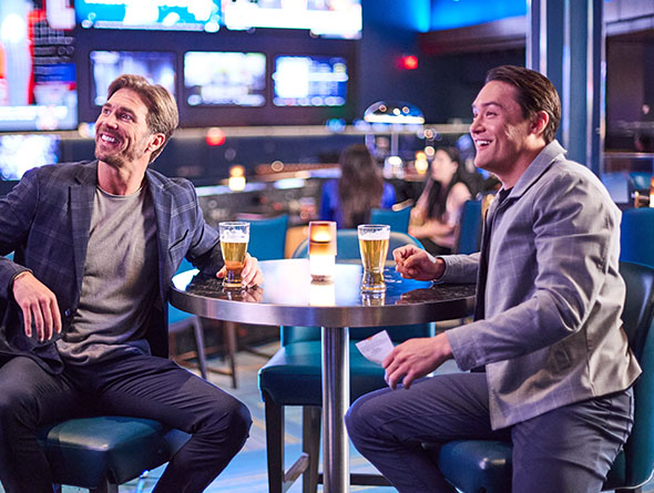 two guys watching the game at a sportsbook